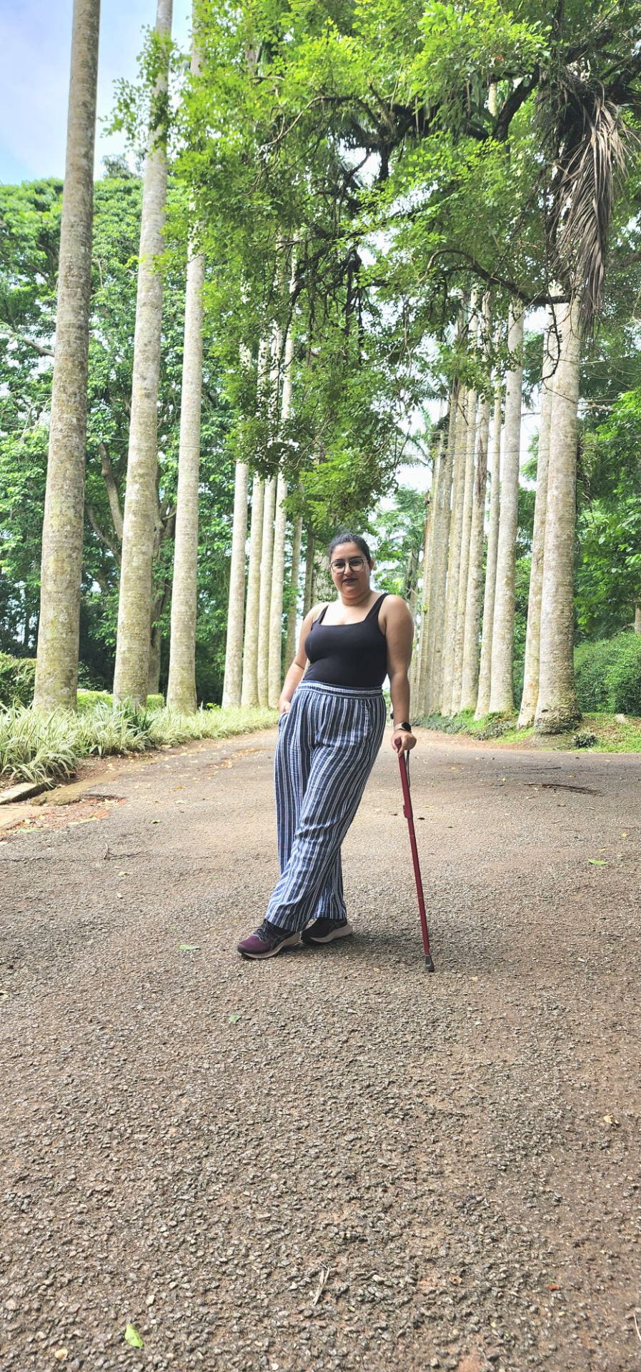 Nahla with her cane at the Aburi botanical gardens